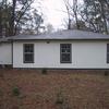 Back of house after new windows, hardi siding, paint and roof.