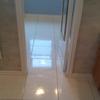 Carpet removed from bathroom porcelain tiles installed