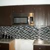 Refinished cabinets, glass subway backsplash, granite countertop, undermount stainless steel sink