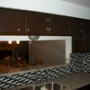 Complete cabinet refinishing granite counter tops and glass backsplash